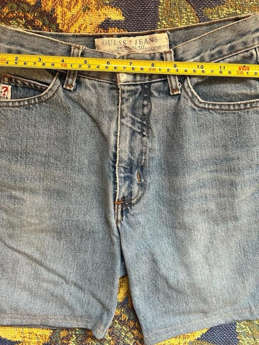Vintage 1990s GUESS blue light wash 100% cotton denim shorts